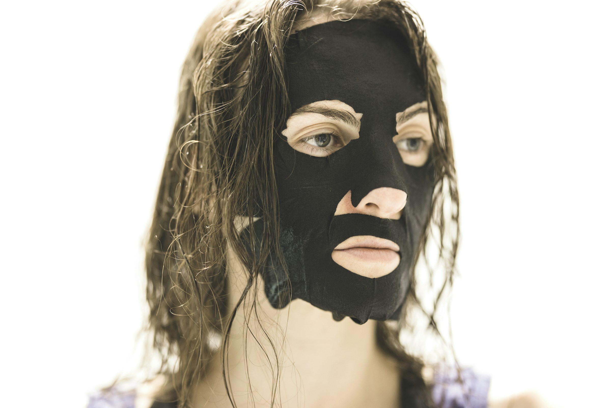 Woman enjoying facial mask treatment